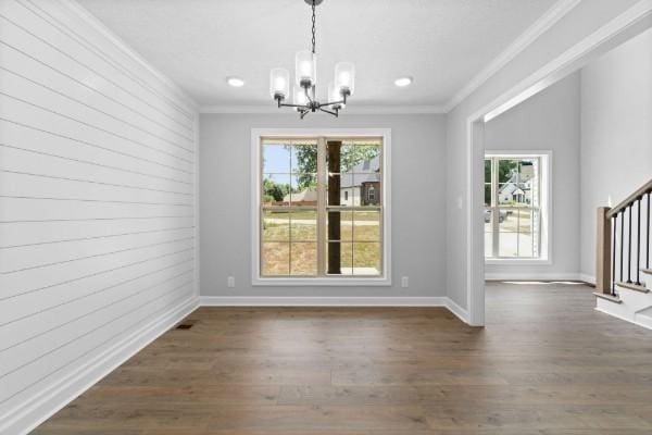 122 Monaghan Dr, Clarksville, TN 37042 - unfurnished dining area with a chandelier, stairs, crown molding, dark wood-style floors, and recessed lighting