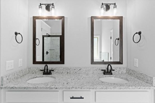 122 Monaghan Dr, Clarksville, TN 37042 - bathroom with double vanity and a shower with shower door