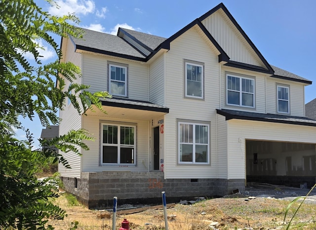 122 Monaghan Dr, Clarksville, TN 37042 - view of front of house with a garage, board and batten siding, and roof with shingles