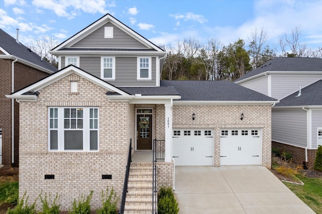 1081 Pebble Run Rd, Hendersonville, TN 37075 - view of front facade featuring concrete driveway, brick siding, a garage, and crawl space