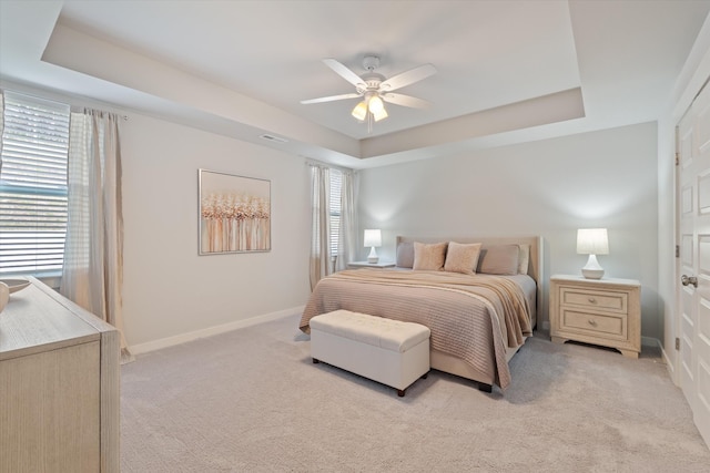1081 Pebble Run Rd, Hendersonville, TN 37075 - bedroom featuring a raised ceiling, multiple windows, light colored carpet, and ceiling fan