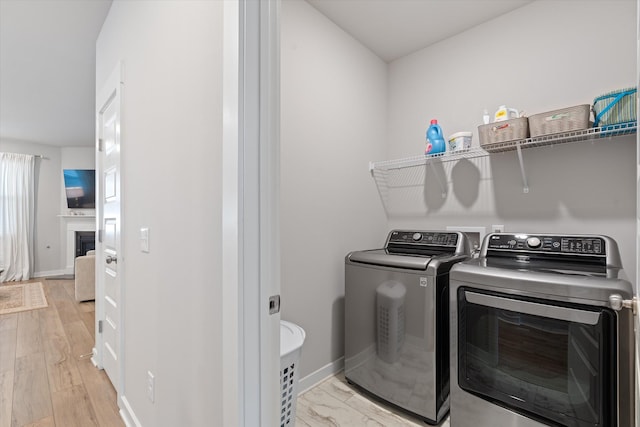1081 Pebble Run Rd, Hendersonville, TN 37075 - laundry room with separate washer and dryer and a fireplace