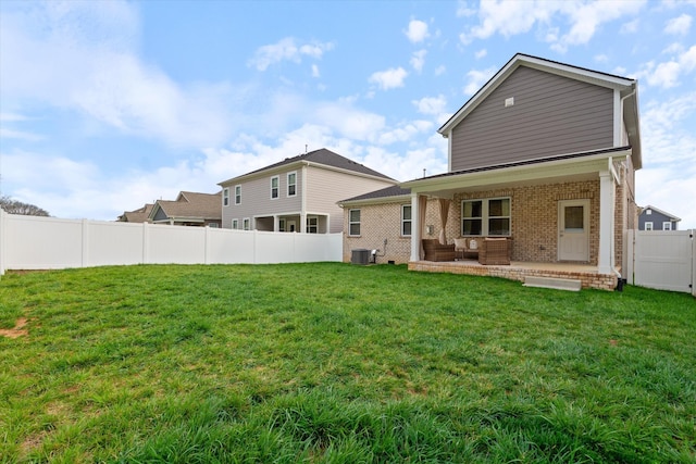 1081 Pebble Run Rd, Hendersonville, TN 37075 - back of house featuring brick siding, a patio, a fenced backyard, and an outdoor living space