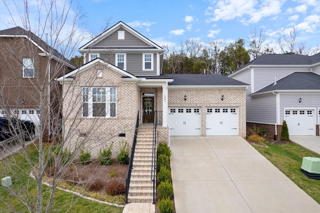 1081 Pebble Run Rd, Hendersonville, TN 37075 - view of front of home with a garage, brick siding, and concrete driveway