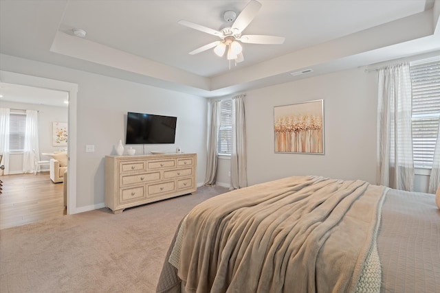 1081 Pebble Run Rd, Hendersonville, TN 37075 - bedroom with multiple windows, light colored carpet, a raised ceiling, and ceiling fan