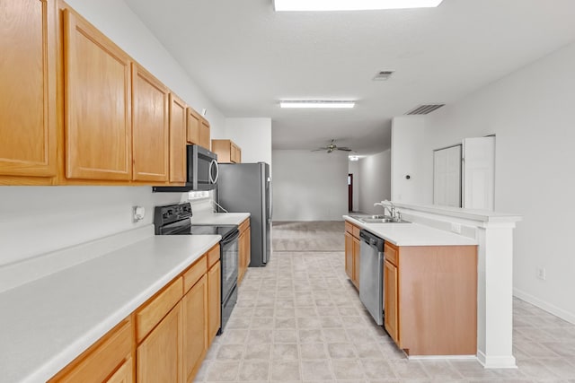219 Wyndom Ct, Goodlettsville, TN 37072 - kitchen featuring stainless steel appliances, light countertops, a ceiling fan, and a center island with sink