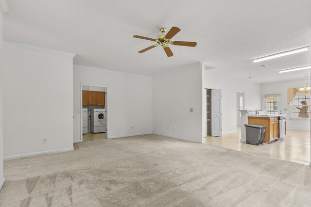 219 Wyndom Ct, Goodlettsville, TN 37072 - unfurnished living room with washer and clothes dryer, light carpet, a ceiling fan, and crown molding
