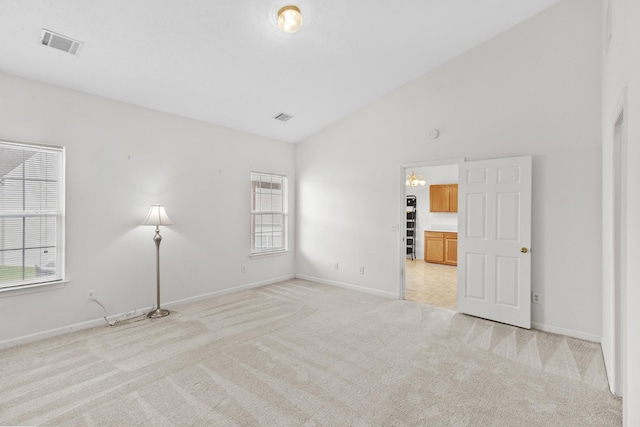 219 Wyndom Ct, Goodlettsville, TN 37072 - empty room featuring light carpet and high vaulted ceiling