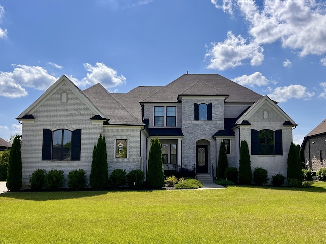 4512 Marymont Springs Blvd, Murfreesboro, TN 37128 - french country inspired facade with brick siding, a front yard, and a shingled roof