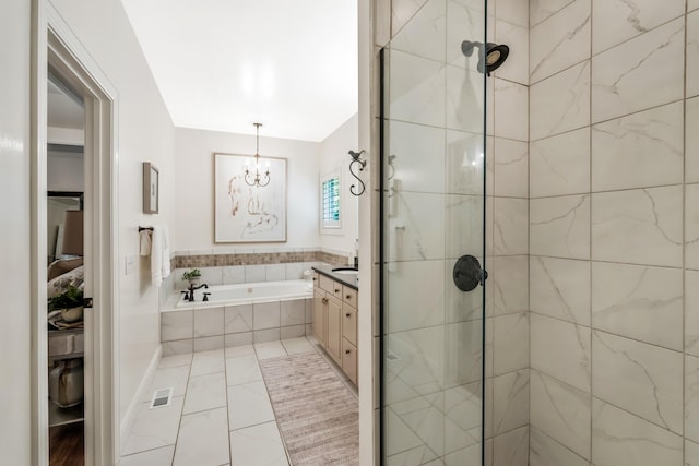 513 Barrington Dr, Franklin, TN 37067 - full bath featuring a chandelier, vanity, a garden tub, and tiled shower