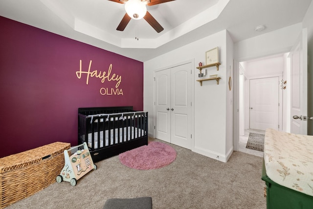 4049 Sadie Grace Way NW, Clarksville, TN 37042 - carpeted bedroom featuring a raised ceiling, a closet, a ceiling fan, and a nursery area