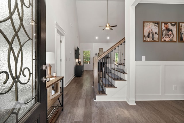 4049 Sadie Grace Way NW, Clarksville, TN 37042 - entryway featuring dark wood finished floors, stairs, high vaulted ceiling, a wainscoted wall, and ceiling fan