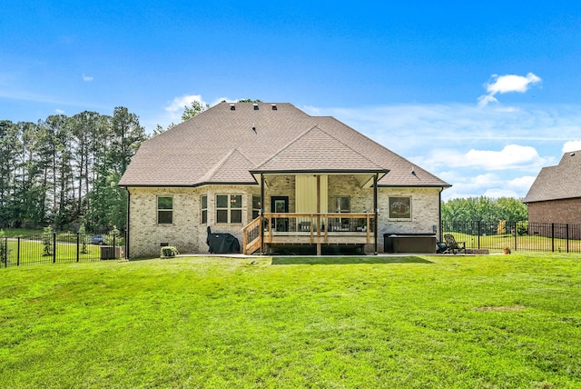 4049 Sadie Grace Way NW, Clarksville, TN 37042 - rear view of house featuring a fenced backyard, a wooden deck, a hot tub, and brick siding