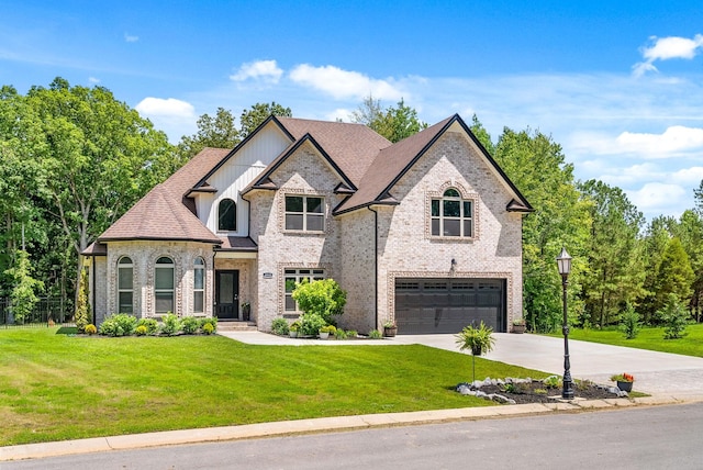 4049 Sadie Grace Way NW, Clarksville, TN 37042 - french country home with an attached garage, concrete driveway, a front yard, and brick siding