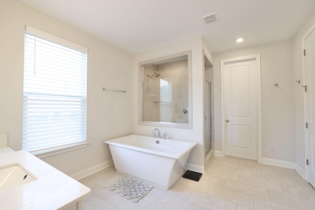 511 Oakvale Ln, Mount Juliet, TN 37122 - bathroom featuring a stall shower, vanity, a freestanding bath, tile patterned floors, and recessed lighting