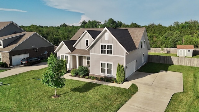 511 Oakvale Ln, Mount Juliet, TN 37122 - view of front of house with board and batten siding, concrete driveway, a shed, roof with shingles, and a wooded view