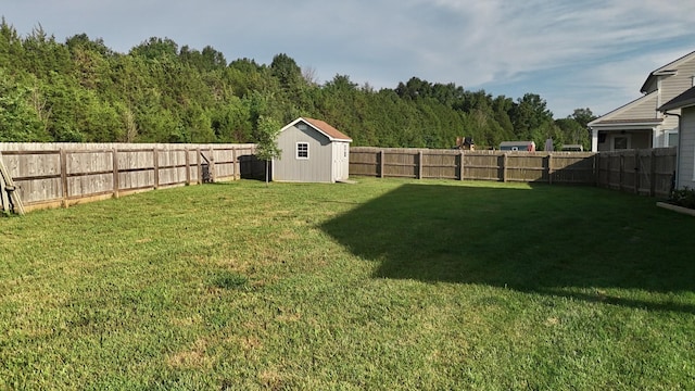 511 Oakvale Ln, Mount Juliet, TN 37122 - fenced backyard featuring a storage unit and a view of trees