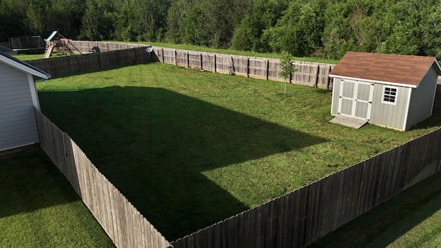 511 Oakvale Ln, Mount Juliet, TN 37122 - fenced backyard with a storage unit and a view of trees