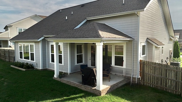 511 Oakvale Ln, Mount Juliet, TN 37122 - back of property with a patio and a shingled roof