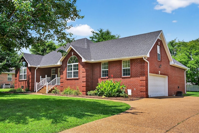 102 Grassmere Ct, Portland, TN 37148 - view of front facade with brick siding, roof with shingles, concrete driveway, and a front lawn