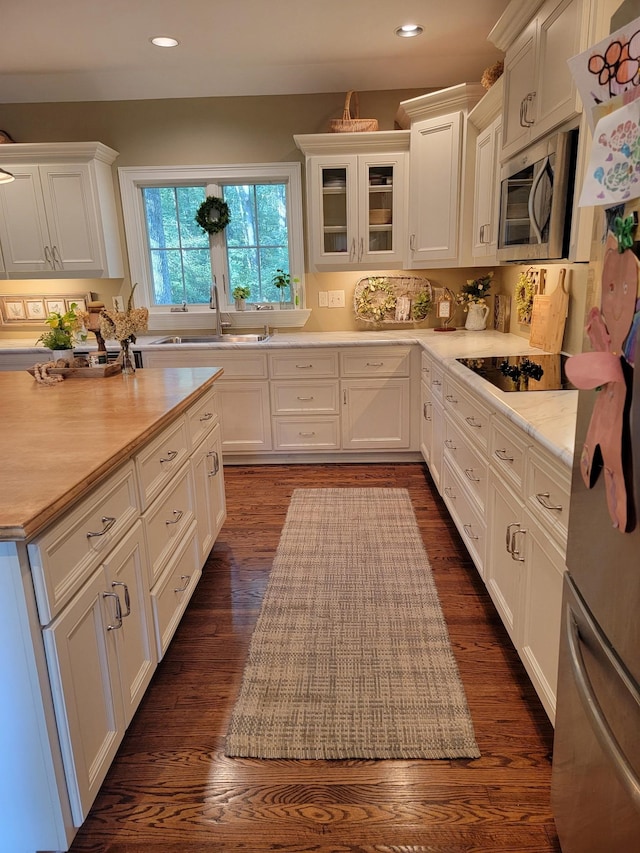 315 Gun Club Rd, Nashville, TN 37205 - kitchen with appliances with stainless steel finishes, white cabinetry, light countertops, recessed lighting, and dark wood-style flooring
