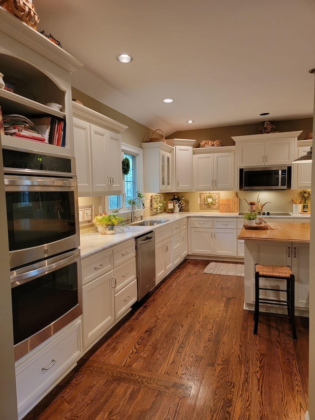 315 Gun Club Rd, Nashville, TN 37205 - kitchen featuring appliances with stainless steel finishes, light countertops, white cabinetry, recessed lighting, and dark wood finished floors