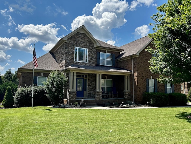 1007 Via Francesco Way, Spring Hill, TN 37174 - craftsman house with a front yard, a porch, brick siding, and roof with shingles