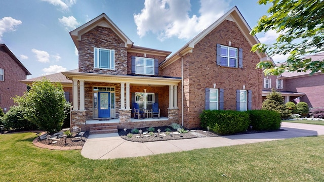 1007 Via Francesco Way, Spring Hill, TN 37174 - view of front of property featuring covered porch and a front lawn