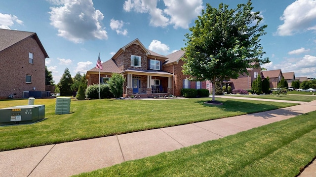 1007 Via Francesco Way, Spring Hill, TN 37174 - view of front of home featuring a front lawn, brick siding, and a porch