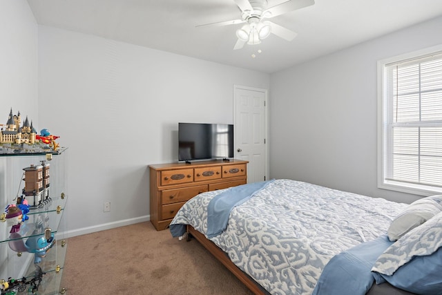 508 Oakmont Dr, Clarksville, TN 37042 - bedroom with light carpet, multiple windows, and a ceiling fan