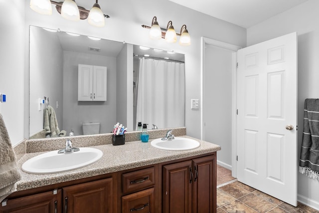 508 Oakmont Dr, Clarksville, TN 37042 - bathroom with double vanity and toilet