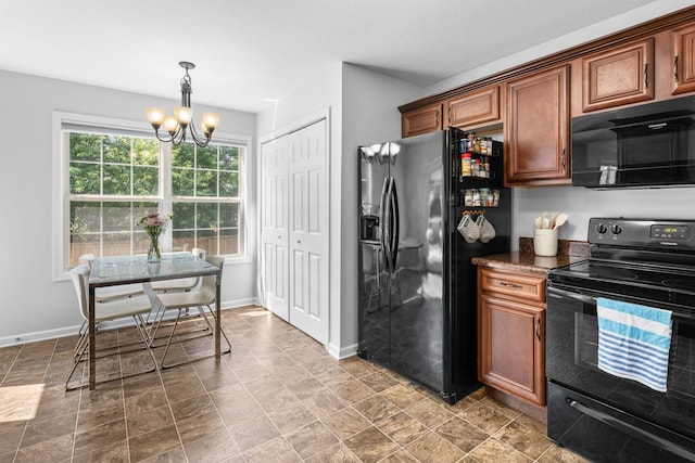 508 Oakmont Dr, Clarksville, TN 37042 - kitchen featuring black appliances, a chandelier, dark countertops, hanging light fixtures, and brown cabinets