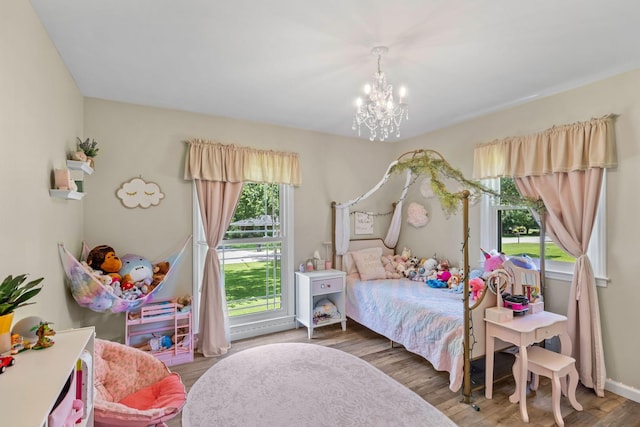 1400 Manor Rd, Columbia, TN 38401 - bedroom with a chandelier and wood finished floors