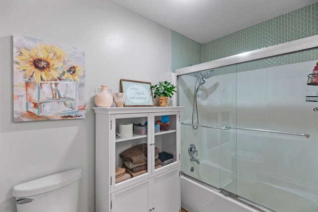 1400 Manor Rd, Columbia, TN 38401 - bathroom featuring toilet and bath / shower combo with glass door