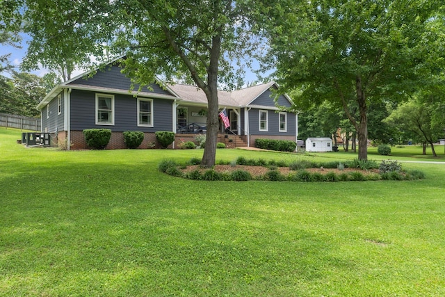 1400 Manor Rd, Columbia, TN 38401 - single story home featuring a front lawn, a shed, and covered porch