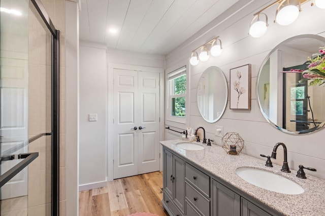 1400 Manor Rd, Columbia, TN 38401 - bathroom featuring wood finished floors, double vanity, and an enclosed shower