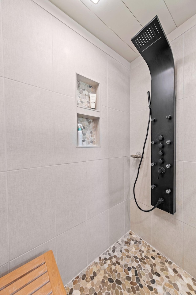 1400 Manor Rd, Columbia, TN 38401 - full bathroom featuring tiled shower and stone finish floors