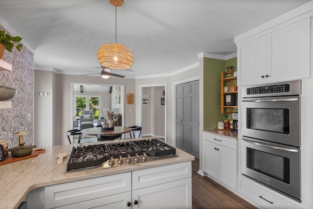 1400 Manor Rd, Columbia, TN 38401 - kitchen with appliances with stainless steel finishes, white cabinets, ornamental molding, a chandelier, and hanging light fixtures