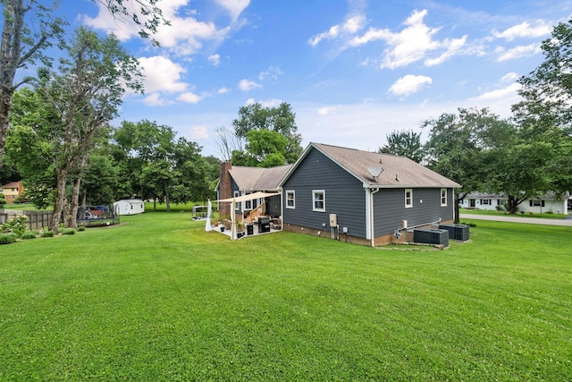 1400 Manor Rd, Columbia, TN 38401 - back of house with a lawn, a chimney, roof with shingles, and a shed