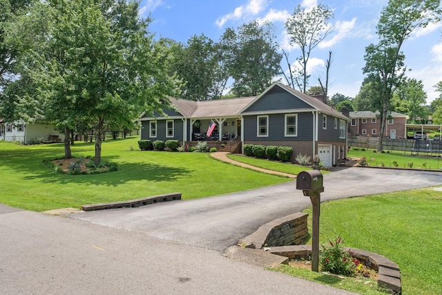 1400 Manor Rd, Columbia, TN 38401 - ranch-style house featuring asphalt driveway, a porch, an attached garage, and brick siding