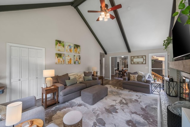 1400 Manor Rd, Columbia, TN 38401 - living room with high vaulted ceiling, wood finished floors, a glass covered fireplace, beam ceiling, and ceiling fan