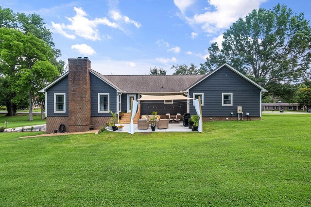1400 Manor Rd, Columbia, TN 38401 - back of property featuring a chimney, a patio area, a lawn, and an outdoor living space