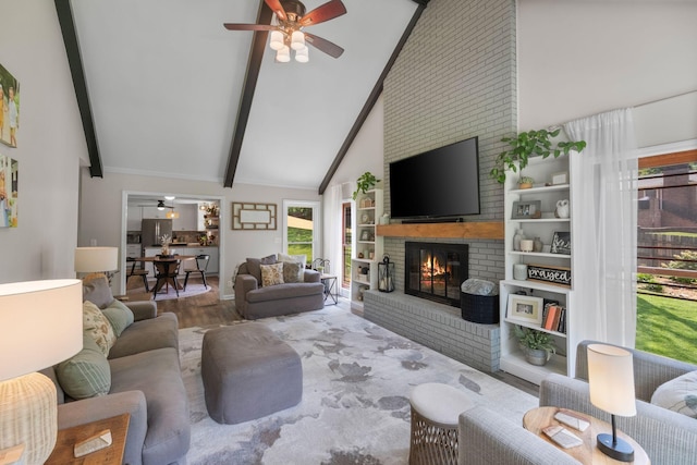 1400 Manor Rd, Columbia, TN 38401 - living area with a fireplace, ceiling fan, beam ceiling, wood finished floors, and high vaulted ceiling