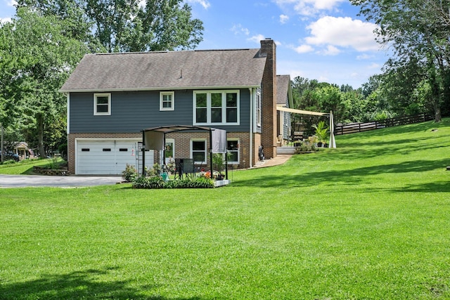 1400 Manor Rd, Columbia, TN 38401 - view of front of house with a chimney, asphalt driveway, brick siding, and a garage