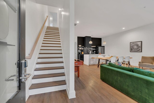 1320 5th Ave N Unit 4, Nashville, TN 37208 - staircase featuring wood finished floors and recessed lighting
