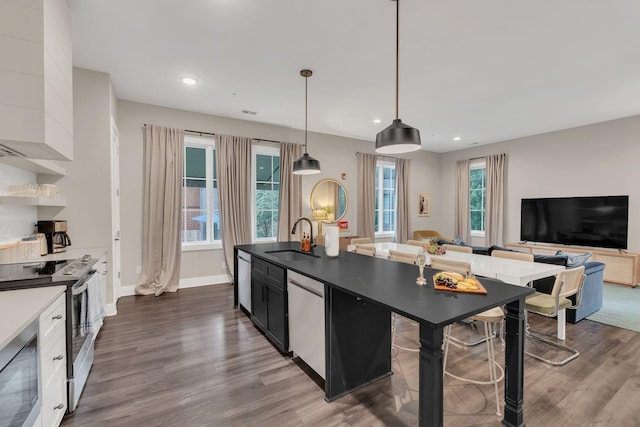 1320 5th Ave N Unit 4, Nashville, TN 37208 - kitchen featuring stainless steel range with electric stovetop, dishwashing machine, built in microwave, dark wood-style floors, and recessed lighting