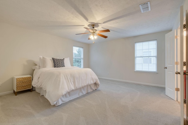 317 Sarava Ln, Smyrna, TN 37167 - bedroom featuring light carpet, a ceiling fan, and a textured ceiling