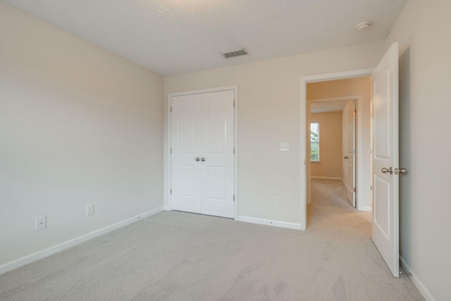 317 Sarava Ln, Smyrna, TN 37167 - unfurnished bedroom with light colored carpet and a textured ceiling