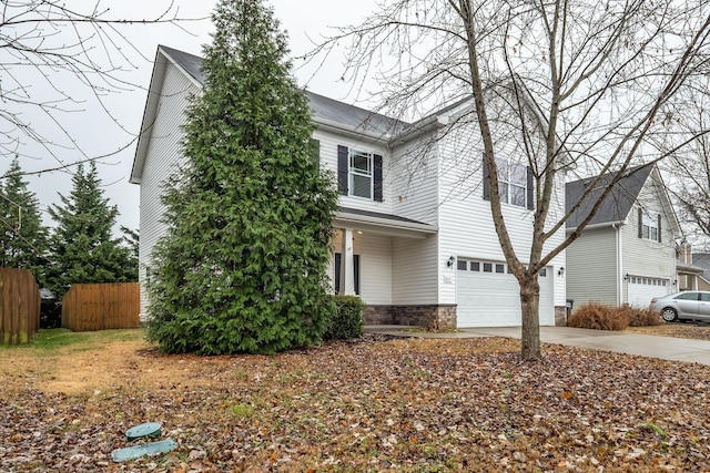 317 Sarava Ln, Smyrna, TN 37167 - view of front of house featuring a garage, concrete driveway, and stone siding