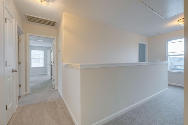 317 Sarava Ln, Smyrna, TN 37167 - hall featuring attic access, light colored carpet, and an upstairs landing